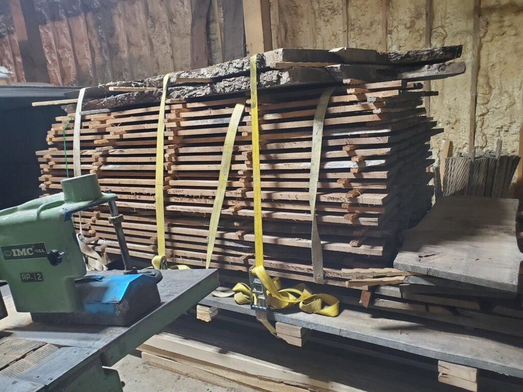Stickered lumber stack strapped and ready to dry